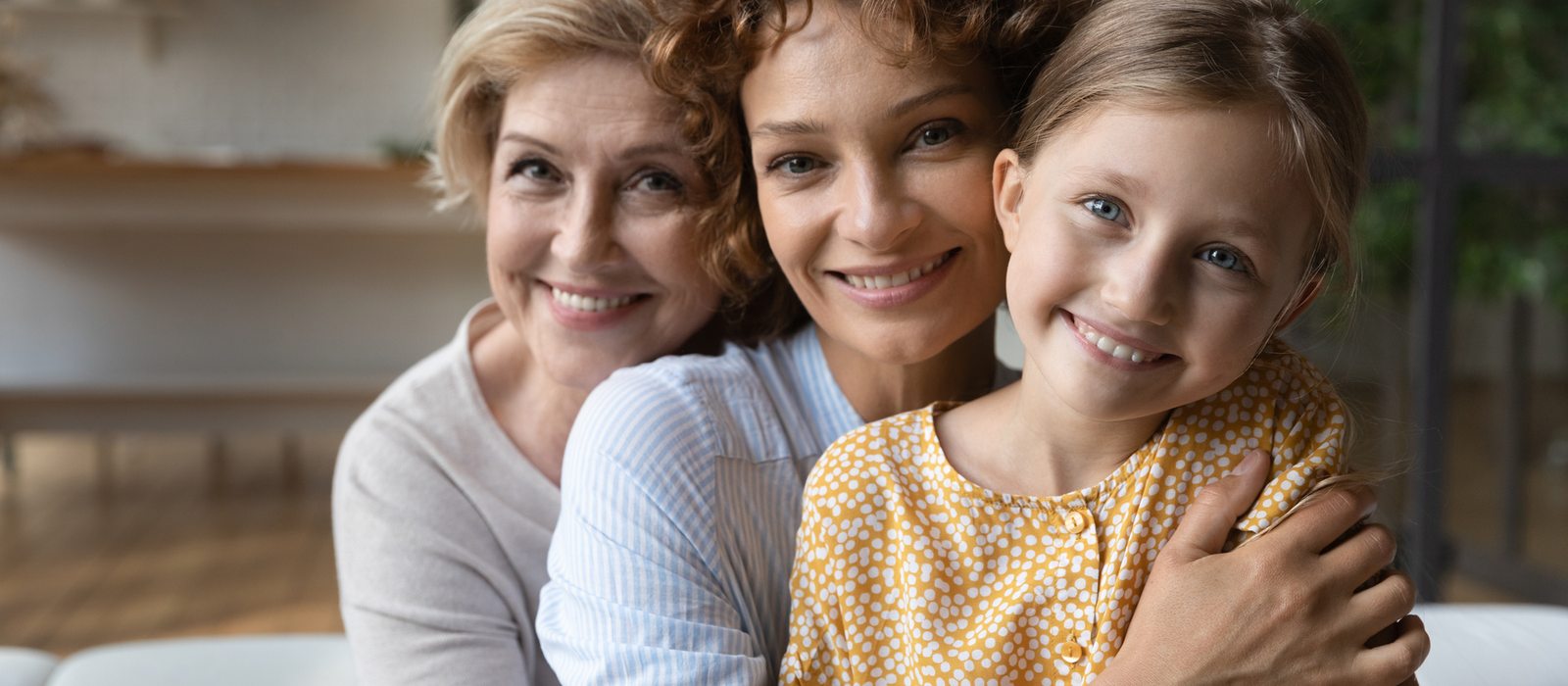 Three generations of women embracing
