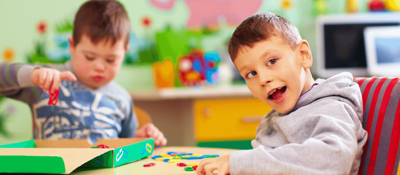 Children playing together, including a child with special needs